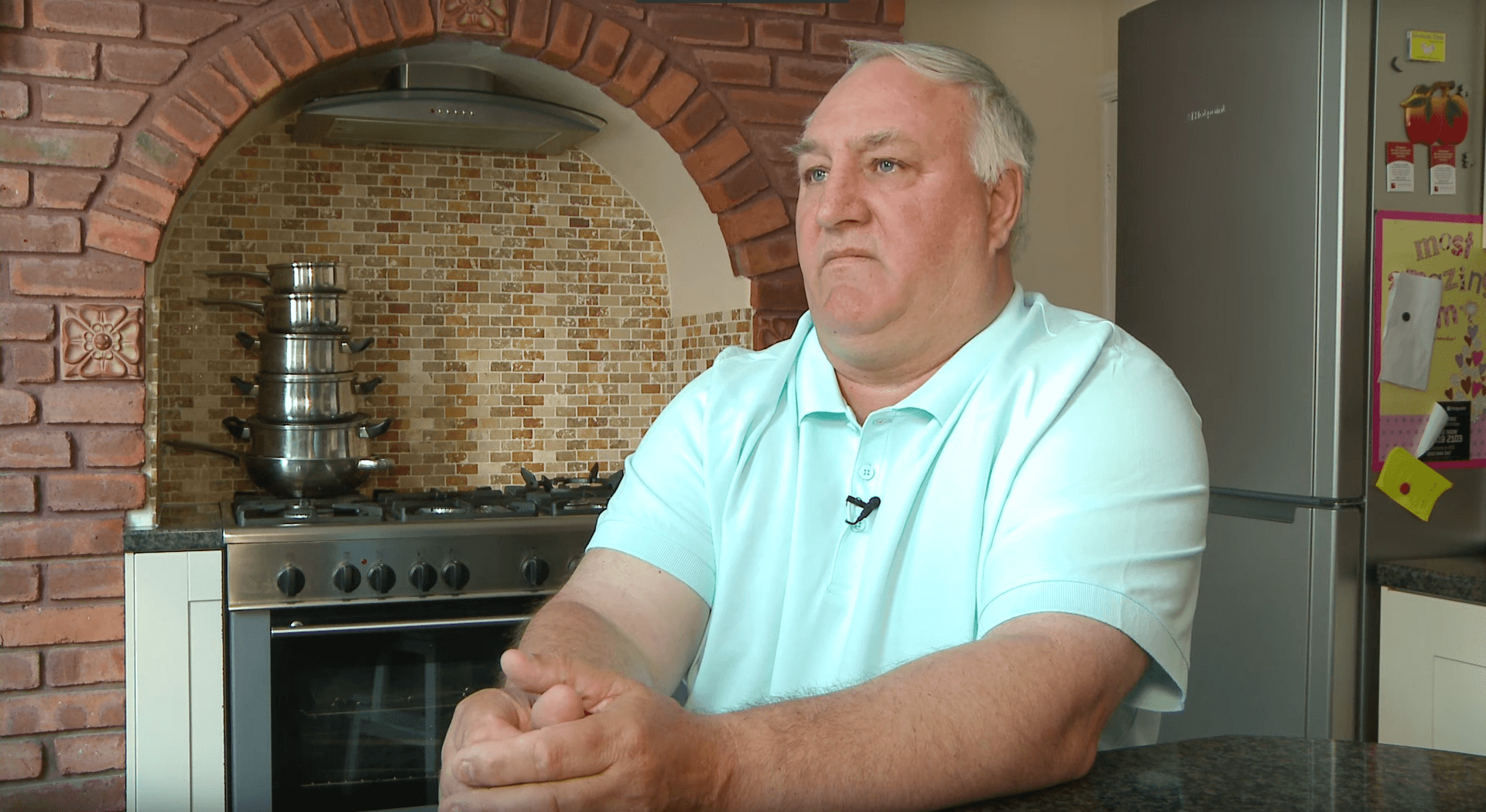 Charile Pearson, a Unite who was exposed to asbestos dust and thus contracted mesothelioma, sitting in his kitchen