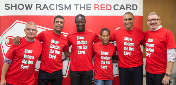 a group of people gathered to support Show Racism the Red Card