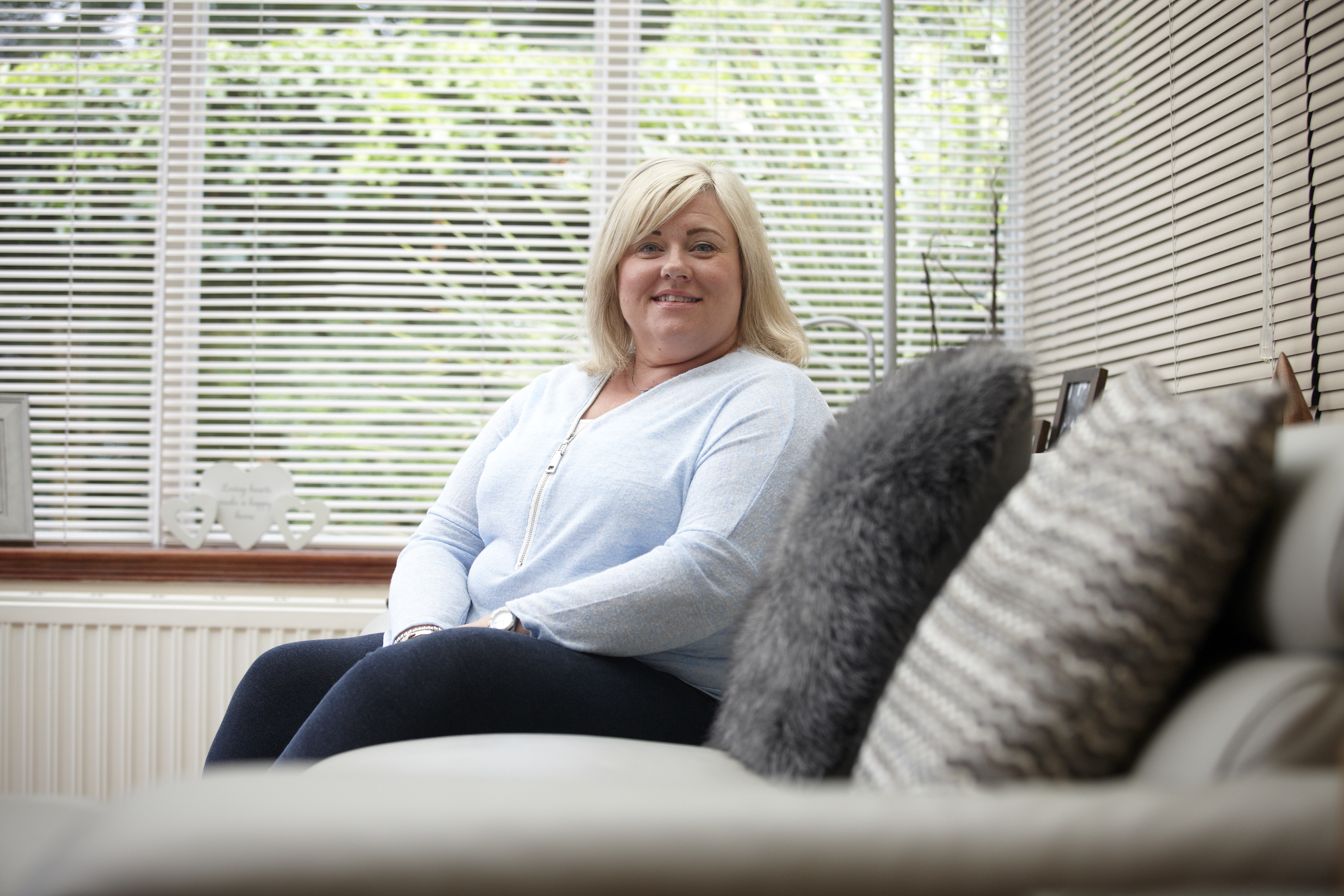 Sarah Thompson, Unite member who fought for compensation following unnecessary surgery, in her living room
