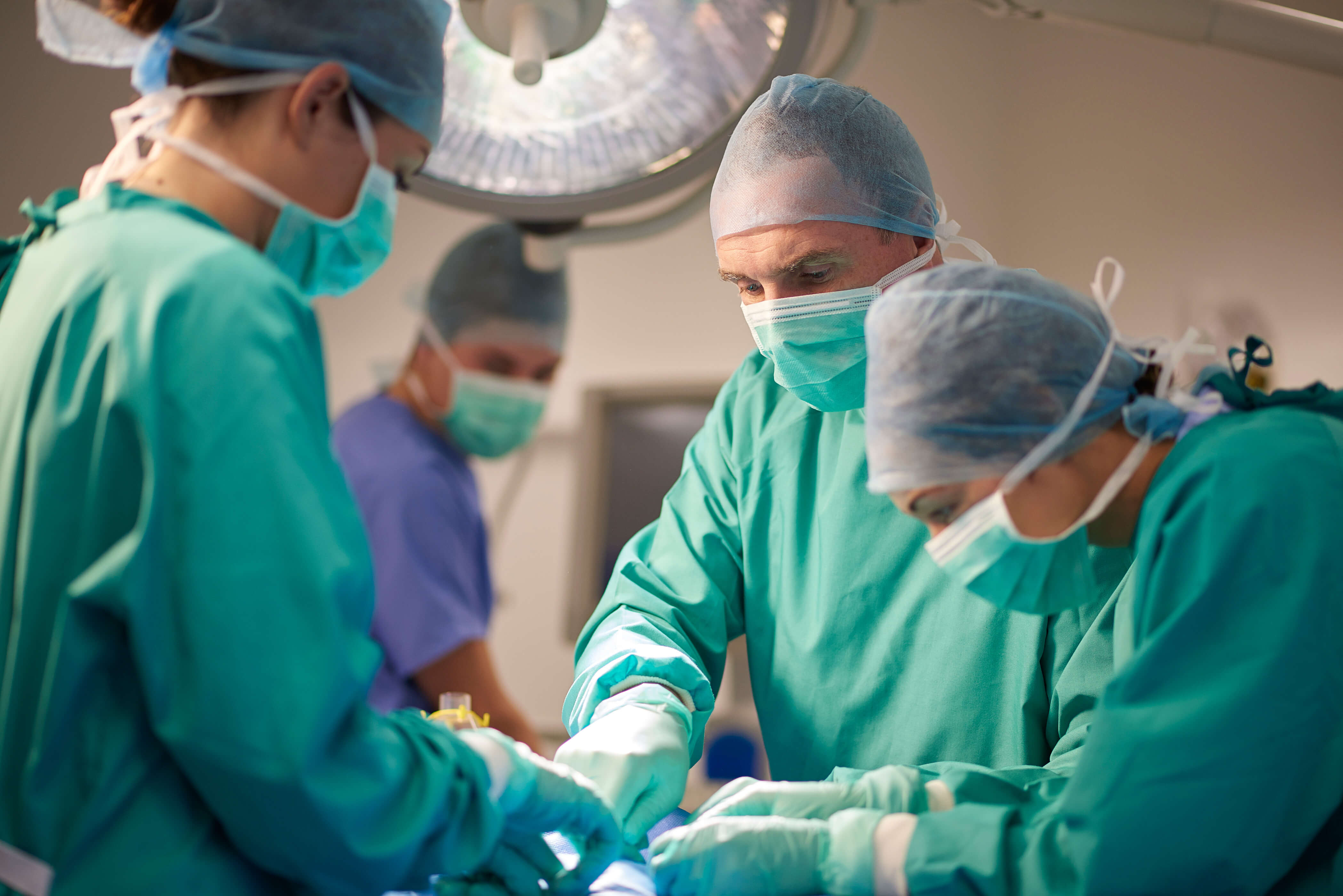 Team of surgeons operating