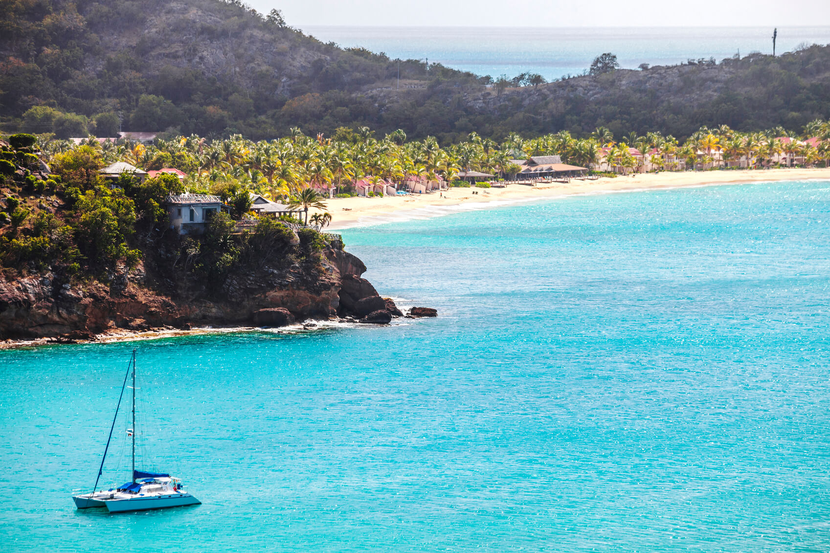 A beautiful Mediterranean beach and blue sea, similar to where our client contracted food poisoning 