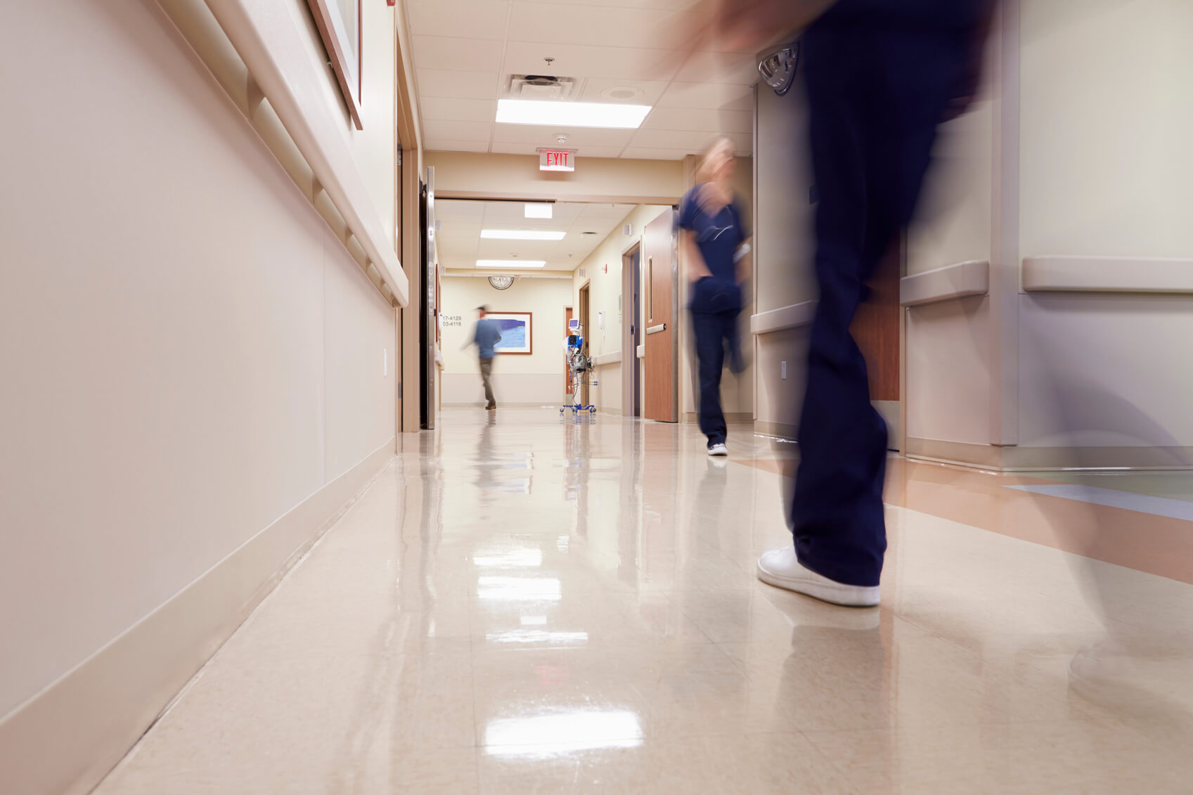 A nursing assistant runs through a corridor, the setting to the accident at work claim
