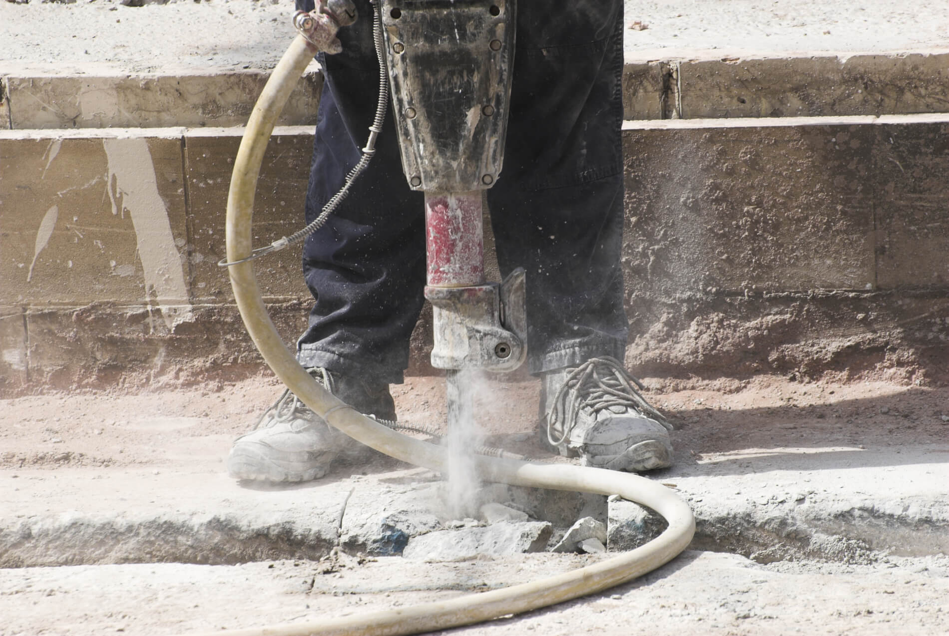 Worker using power drill