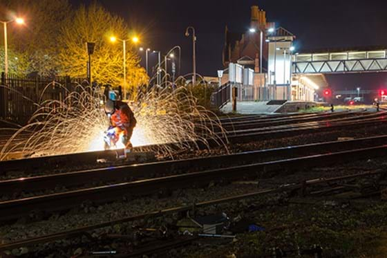 a steel worker with sparks flying