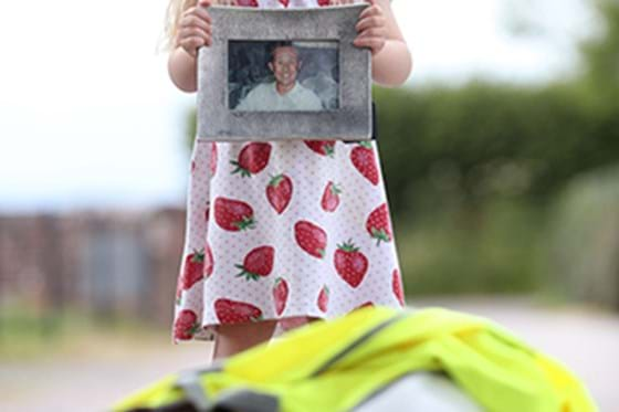 A little girl looking at a parent after an accident