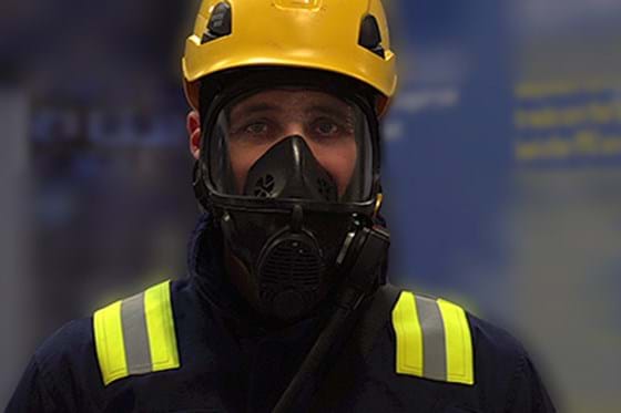 A man wearing full PPE