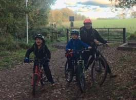 Sean Craven with his two children, all on bicycles