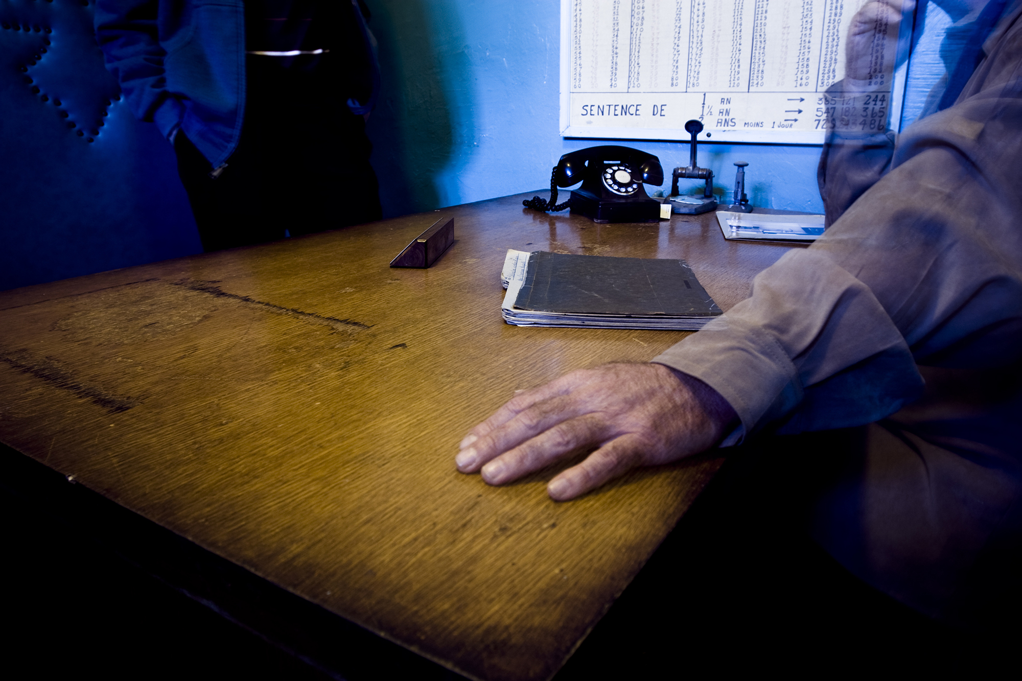 Person leaning on desk at the doctors