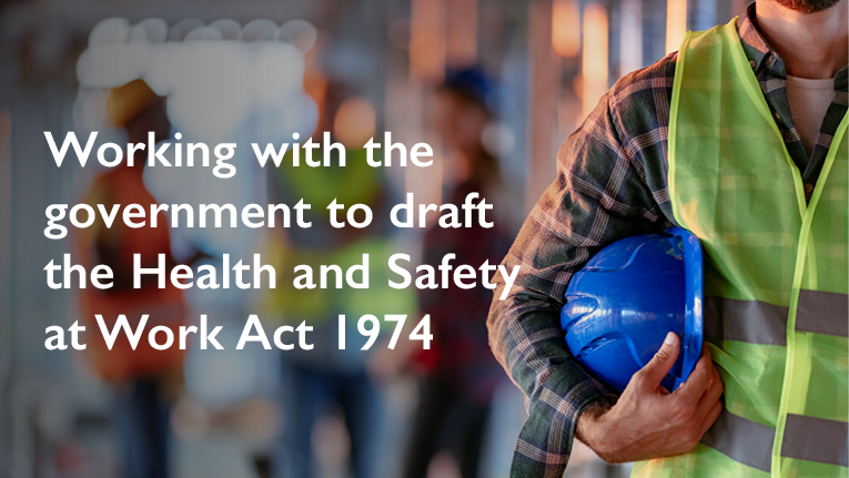 A builder with a hard hat under his arm