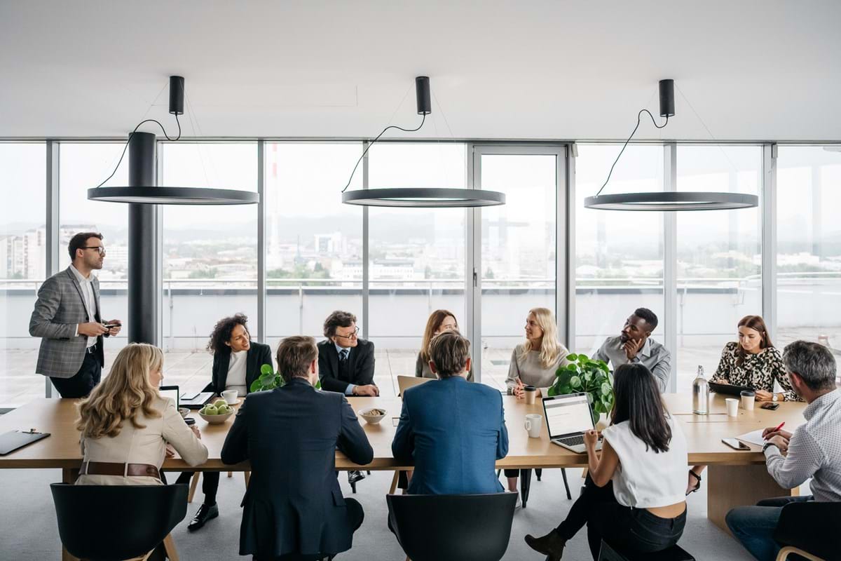 A group of people sat around a table