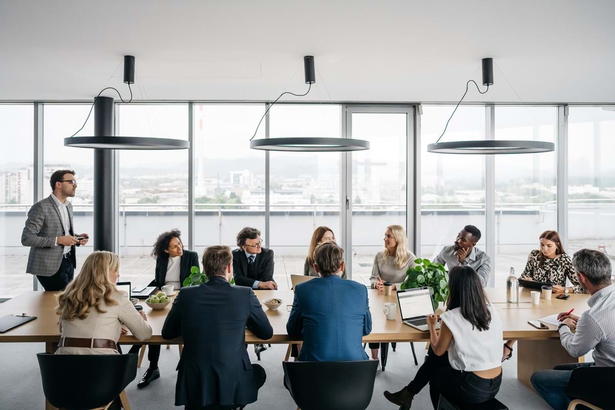 A group of people sat around a table