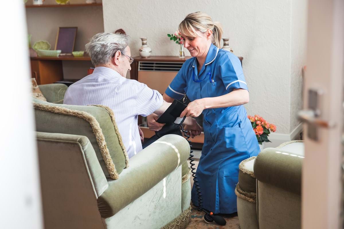 A carer visiting a patient