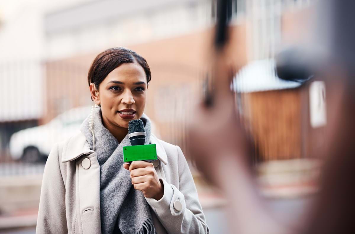 A female journalist with a microphone